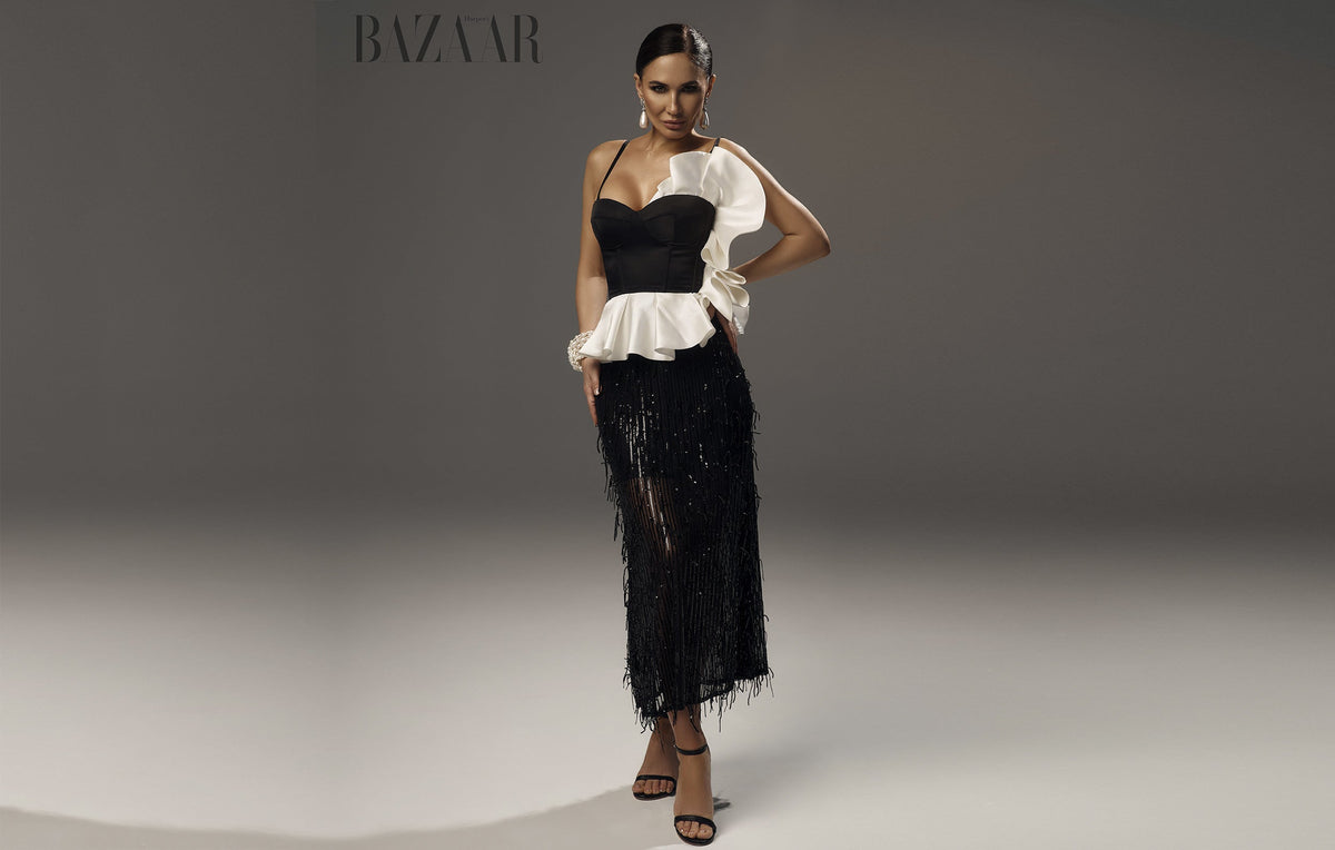 Black evening dress with a white bow, editorial