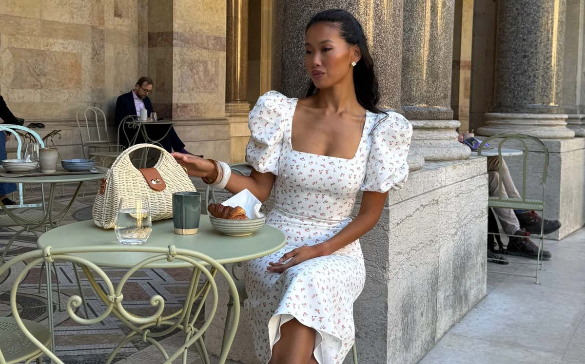 Woman in a white lace dress with puff sleeves