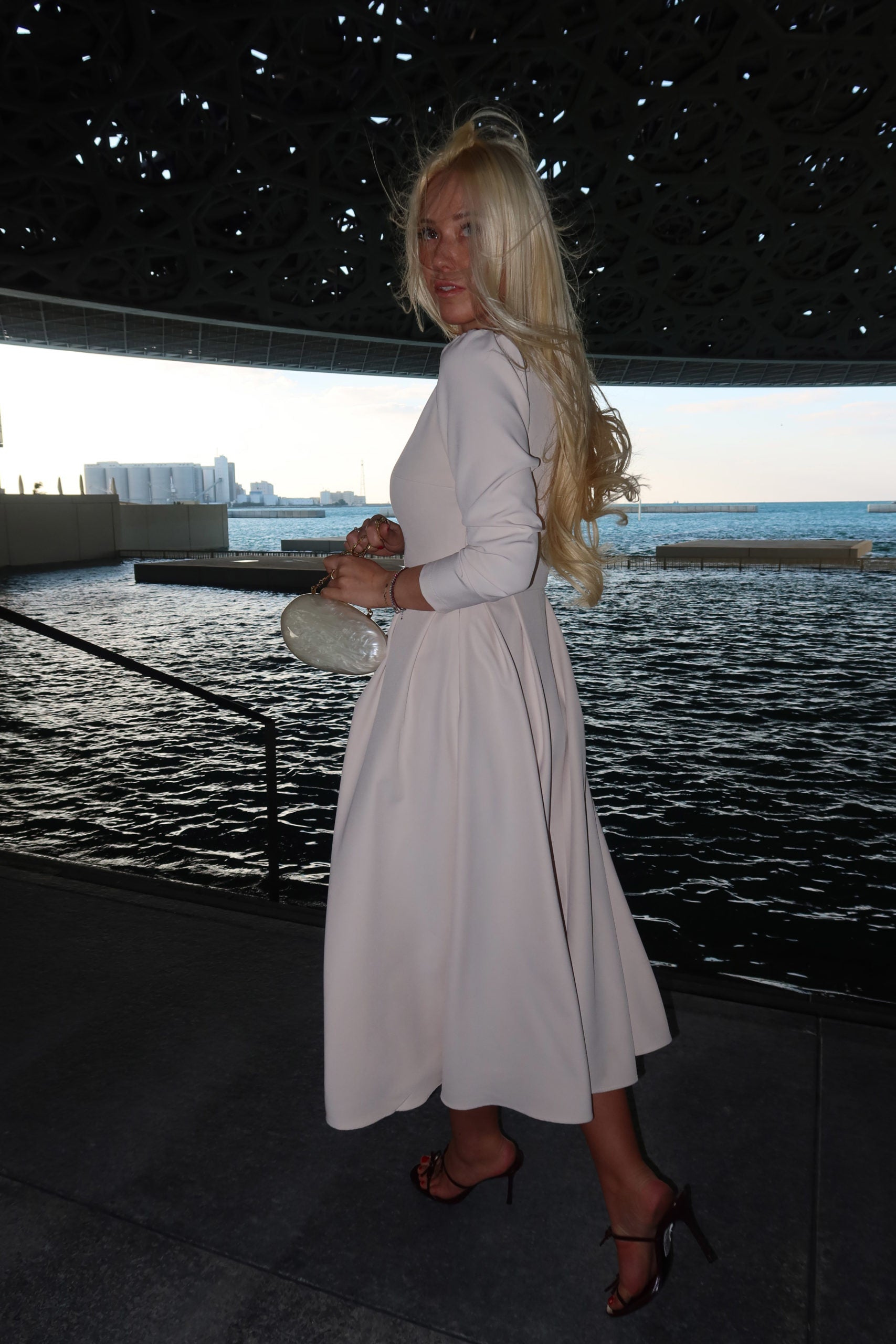 Midi dress with V neckline and pleated skirt