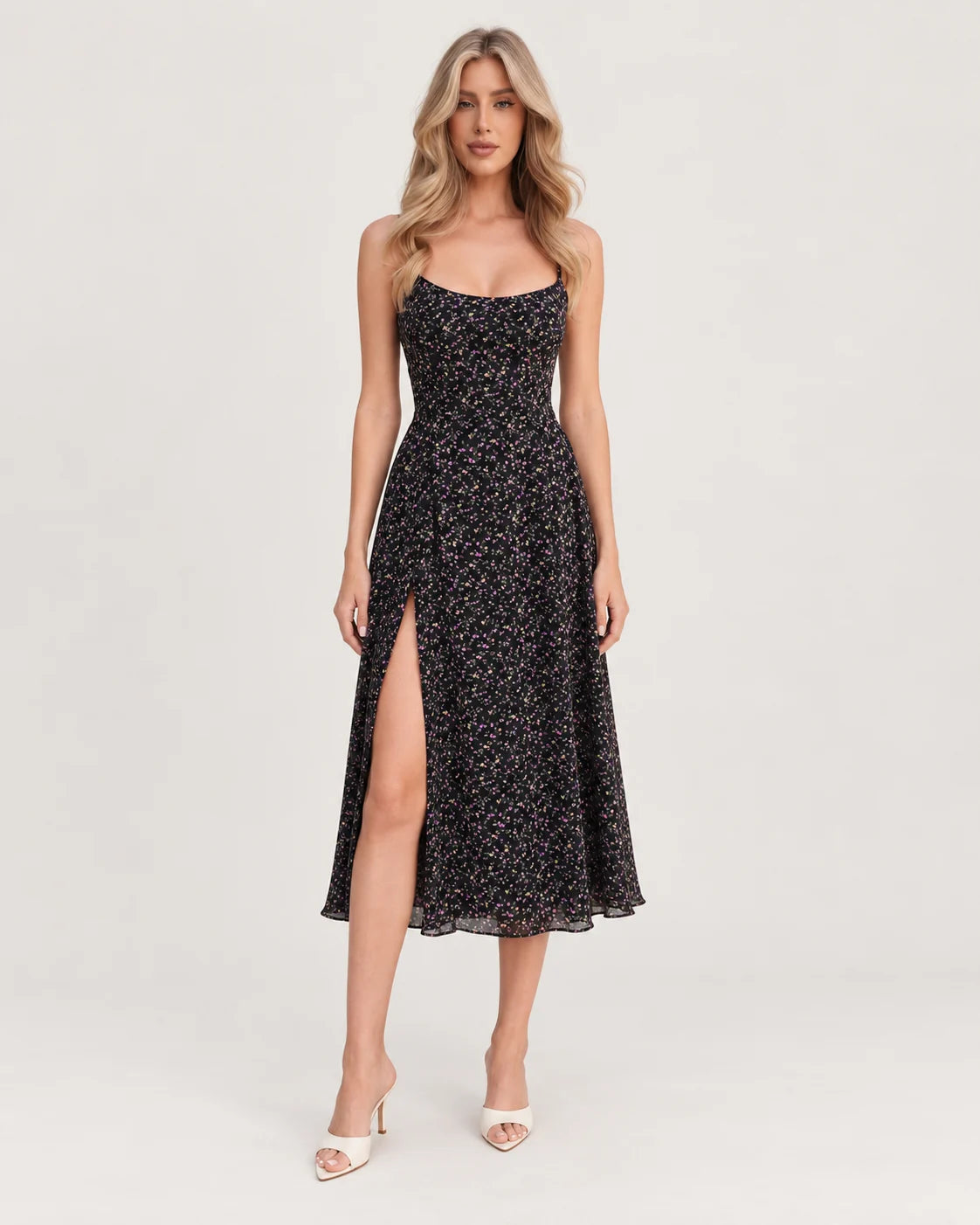Black printed midi dress with straps and a slit skirt — front view