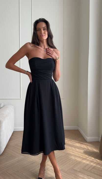 Bustier dress with a draped bodice and a pleated skirt