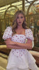 Black printed midi dress with straps and a slit skirt — video